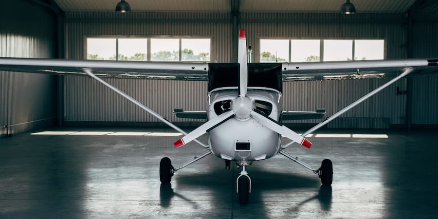 How Much Does A Small Aircraft Cost Small airplane inside a hangar.