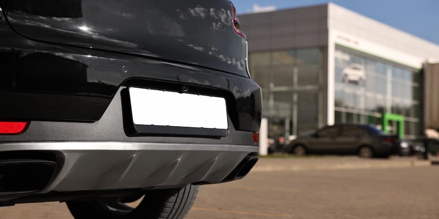 Mail Forwarding & Addressing What Goes Where for LLC Vehicles Car rear near dealership building