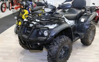 All-terrain vehicle on display indoors.
