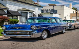 Classic Chevrolet cars parked on suburban street