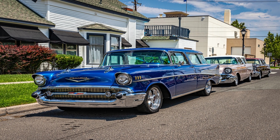 Classic Chevrolet cars parked on suburban street