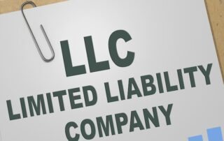 LLC documents on clipboard with paperclip