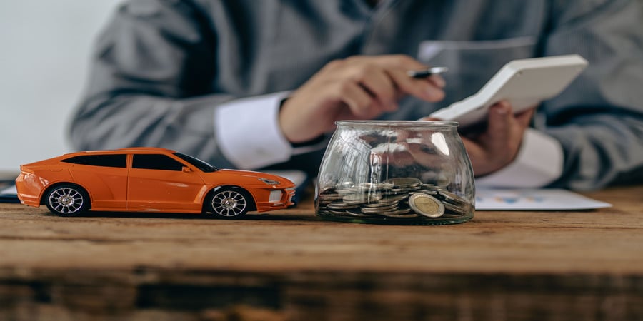 Taxfree RV showcases The Montana Luxury Vehicle Registration Fee using a toy SUV and calculator to reflect vehicle costs and smart registration budgeting.